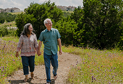 Geoffrey & Jeannie enjoy a walk outdoors